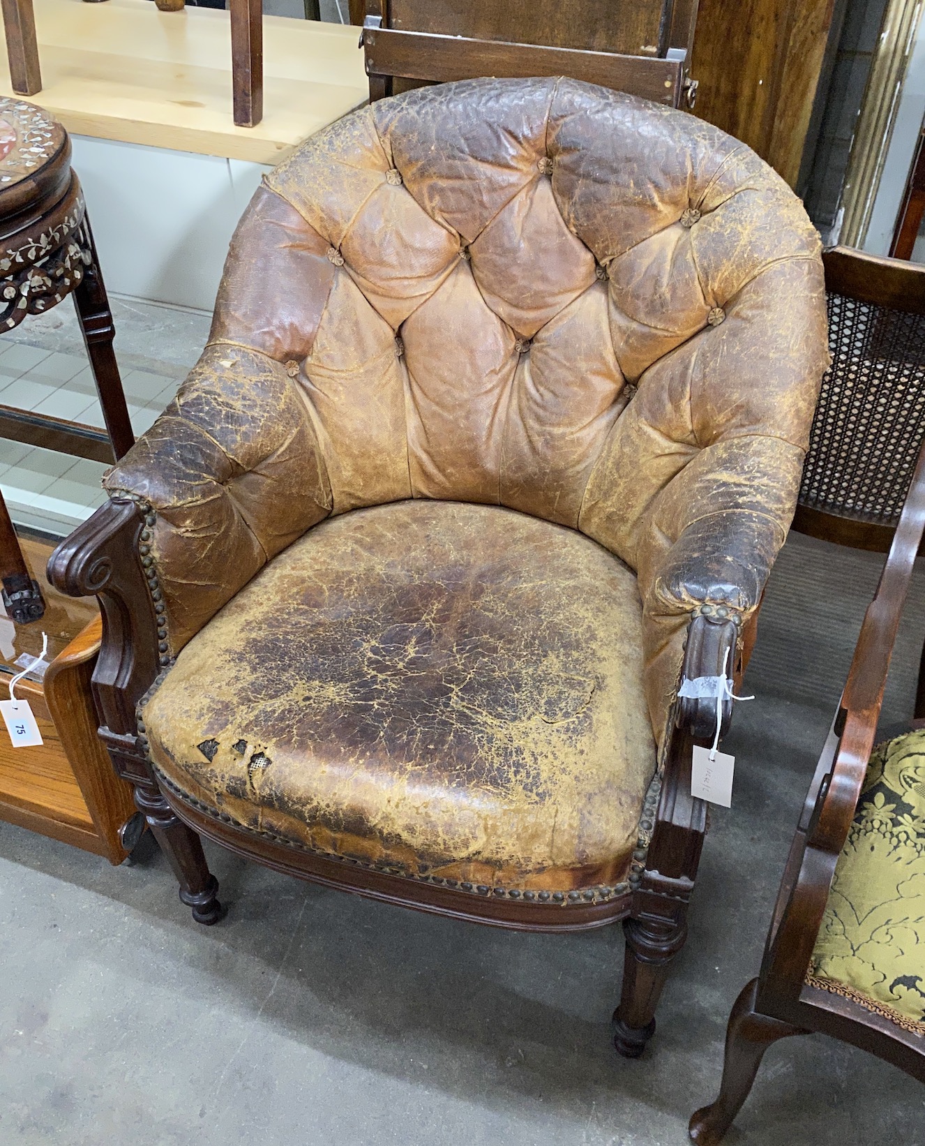 An early Victorian buttoned brown leather mahogany library chair, width 68cm, depth 54cm, height 94cm